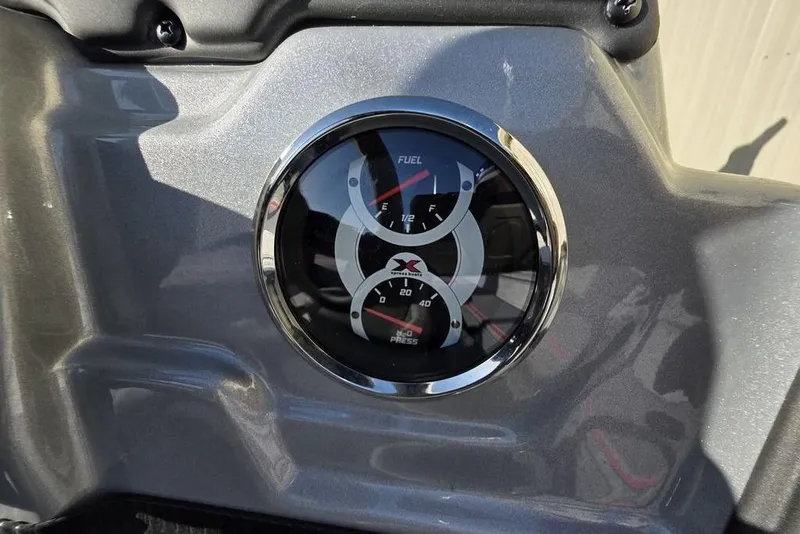 Slide: The Image of 2025 Xpress H18C Crappie dashboard with fuel and pressure gauges. - 16