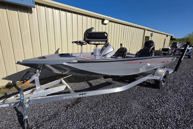 Slide: The Image of 2025 Xpress H18C Crappie boat on trailer, parked outdoors near a building. - 4