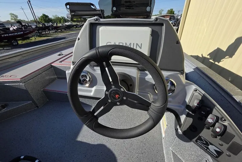 Slide: The Image of Steering console of 2025 Xpress H18C Crappie boat with Garmin display. - 9