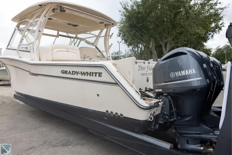Slide: The Image of 2019 Grady-White Freedom 335 boat with Yamaha engines, parked on a trailer. - 1