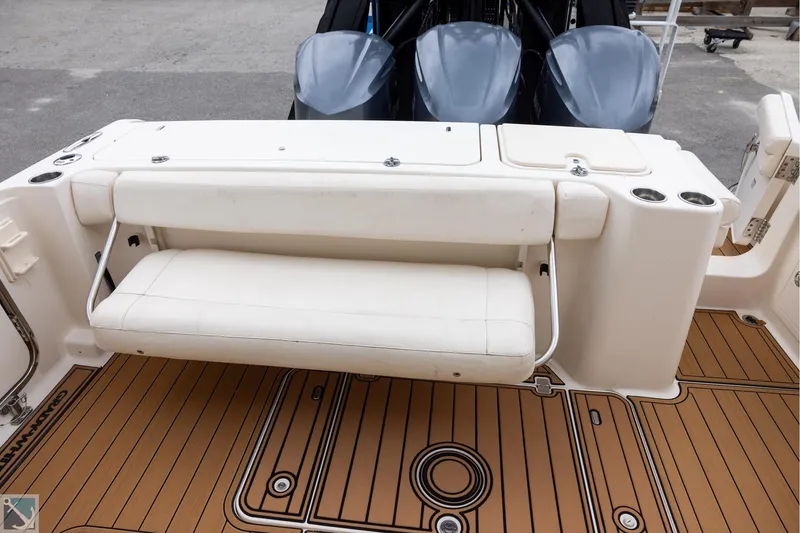 Slide: The Image of 2019 Grady-White Freedom 335 boat with foldable seating and twin engines. - 10