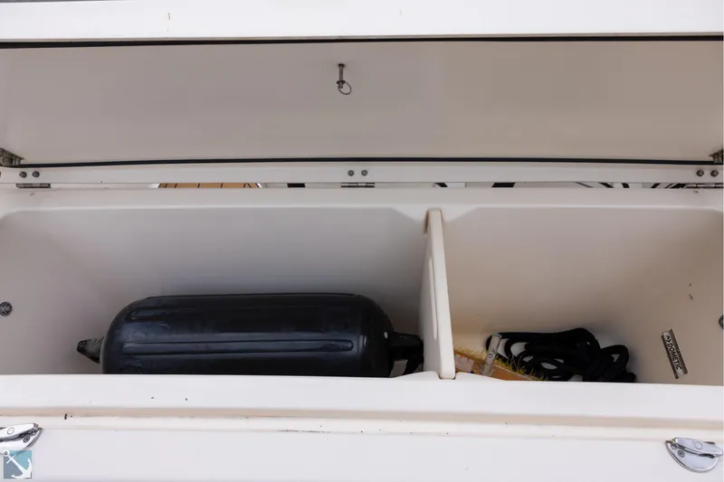 Slide: The Image of 2019 Grady-White Freedom 335 storage compartment with fender and accessories. - 12