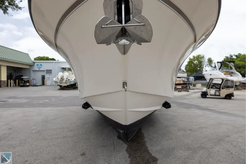 Slide: The Image of 2019 Grady-White Freedom 335 boat front view at a marina. - 3