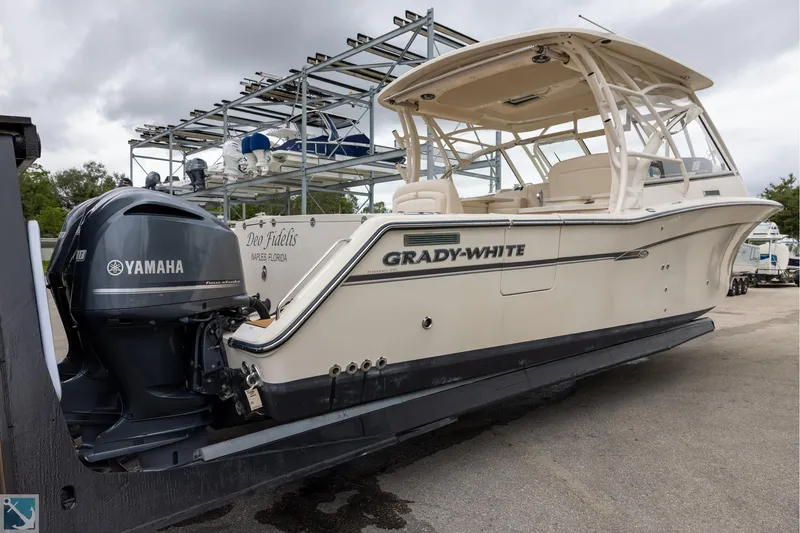 Slide: The Image of 2019 Grady-White Freedom 335 boat with Yamaha engine, docked outdoors. - 6