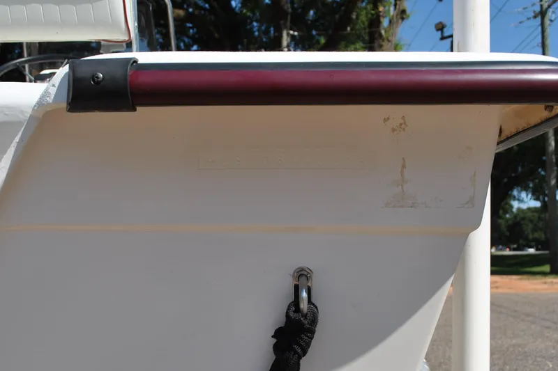 Slide: The Image of Rear view of a 2003 Cape Craft 16 boat with a rope and metal hook. - 11