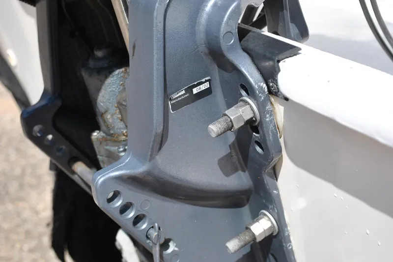 Slide: The Image of Close-up of a 2003 Cape Craft 16 boat motor mount with visible bolts. - 12