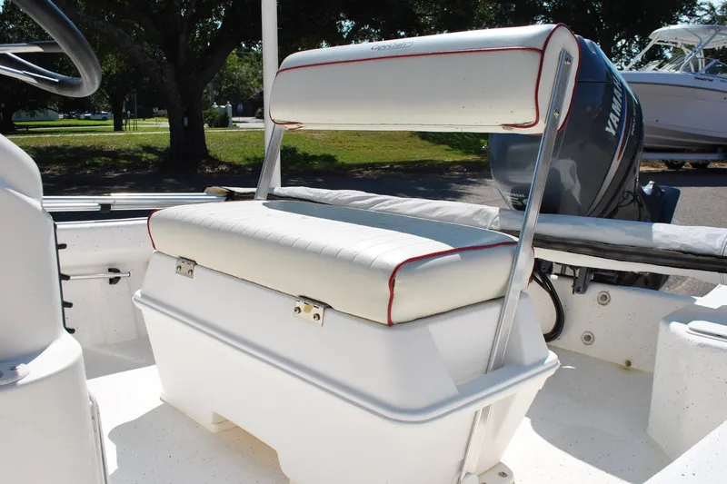 Slide: The Image of 2003 Cape Craft 16 boat interior with cushioned seating and Yamaha outboard motor. - 17