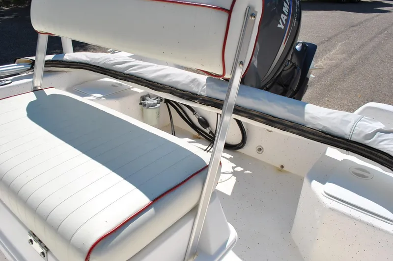 Slide: The Image of 2003 Cape Craft 16 boat interior with white seating and Yamaha outboard motor. - 19