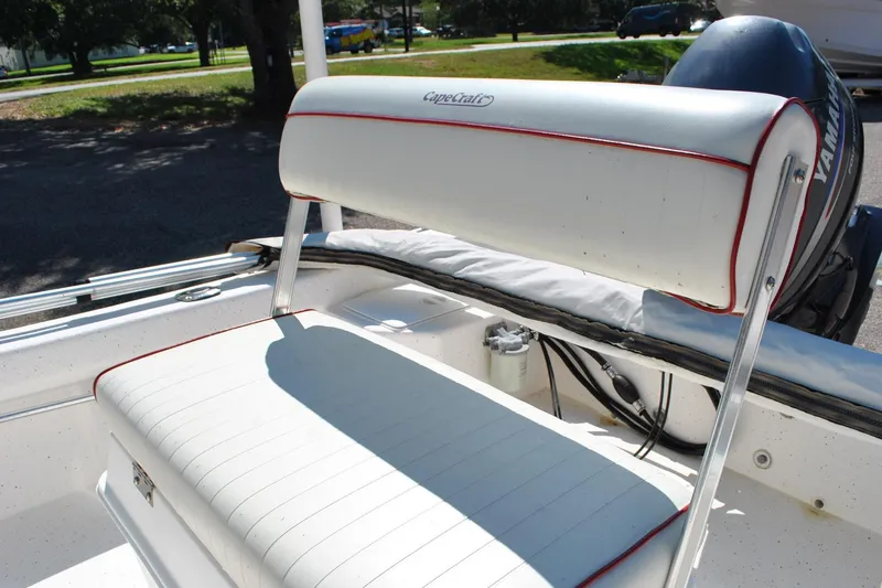 Slide: The Image of 2003 Cape Craft 16 boat with white seating and Yamaha motor in a sunny outdoor setting. - 21