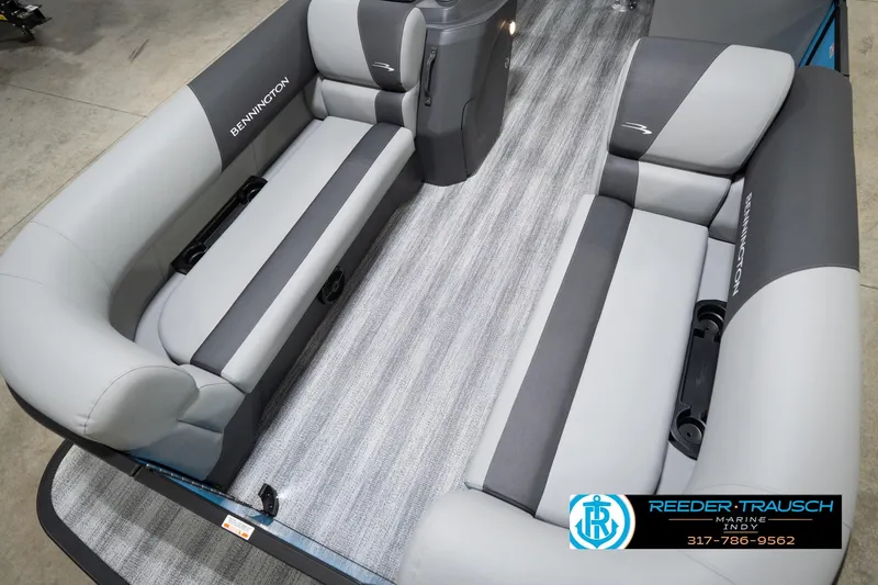 Slide: The Image of 2026 Bennington 188 SL boat interior with gray seating and carpeted flooring. - 11