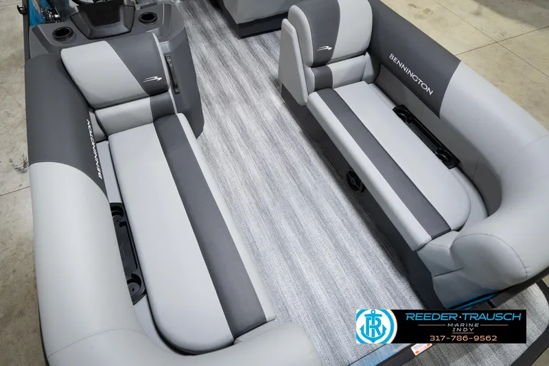 Slide: The Image of 2026 Bennington 188 SL boat interior with gray seating and Reeder Trausch Marine logo. - 12