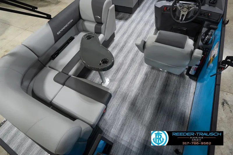 Slide: The Image of 2026 Bennington 188 SL boat interior with gray seating and steering console. - 13