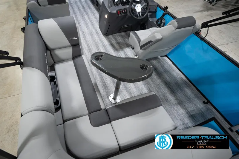 Slide: The Image of Interior of 2026 Bennington 188 SL pontoon boat with gray seating and steering console. - 14