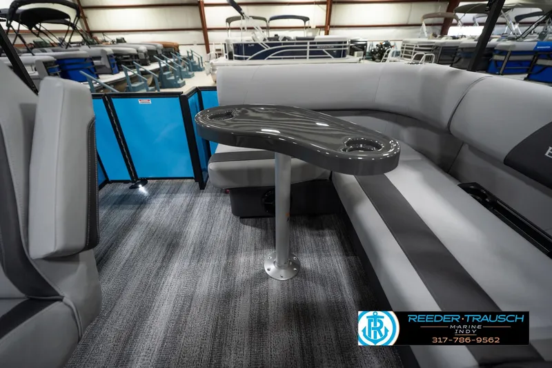 Slide: The Image of 2026 Bennington 188 SL pontoon boat interior with sleek seating and table. - 17