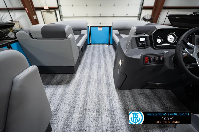 Slide: The Image of Interior of 2026 Bennington 188 SL pontoon boat with modern seating and dashboard. - 19