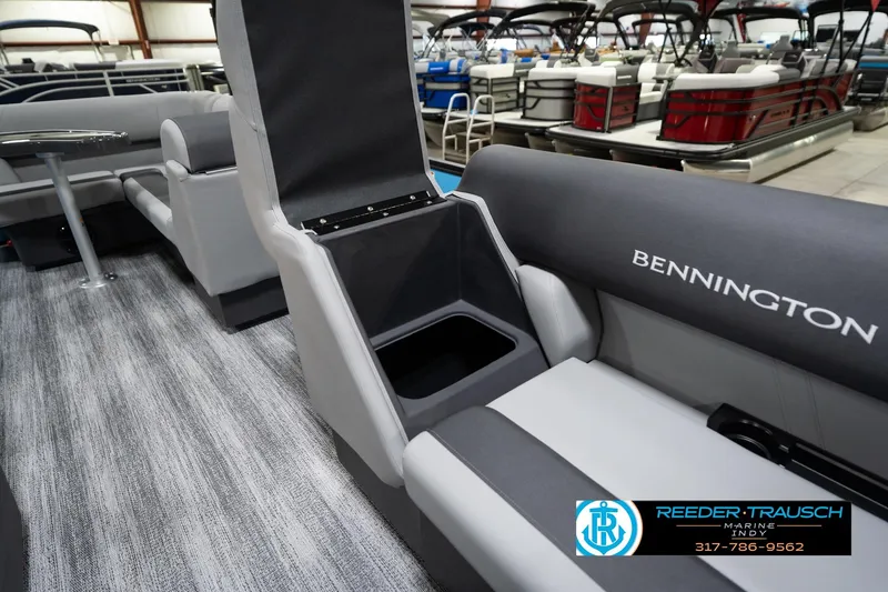 Slide: The Image of 2026 Bennington 188 SL pontoon boat interior with seating and storage, displayed at Reeder-Trausch Marine. - 23