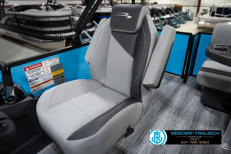 Slide: The Image of 2026 Bennington 188 SL boat seat with gray upholstery and safety labels. - 24