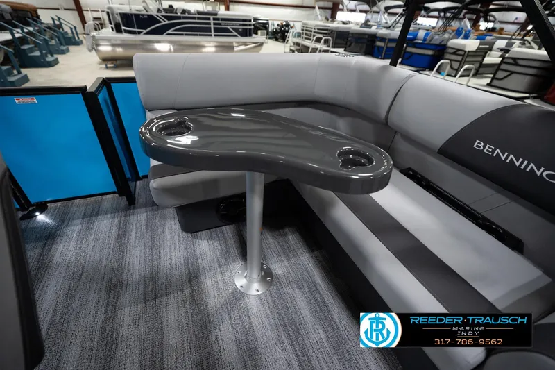 Slide: The Image of 2026 Bennington 188 SL pontoon boat interior with gray seating and table. - 26