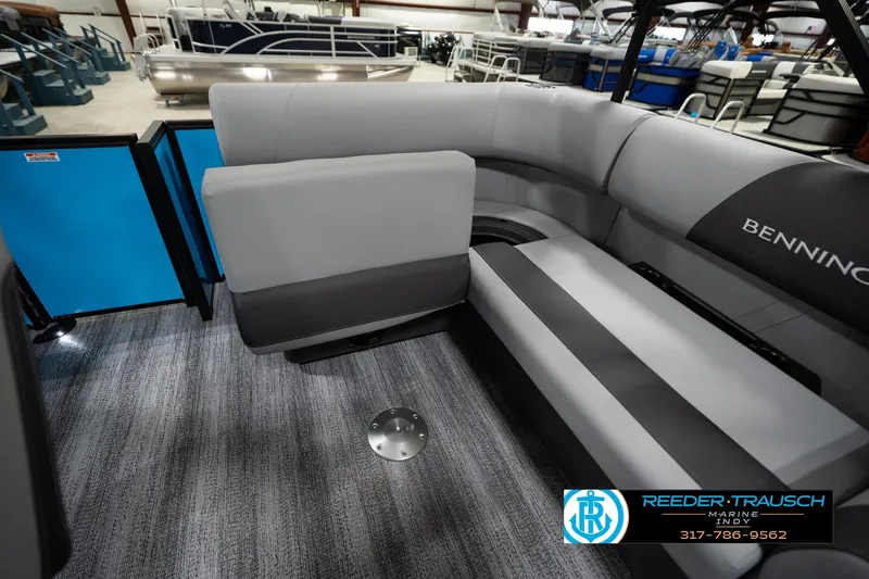 Slide: The Image of Interior of 2026 Bennington 188 SL pontoon boat with gray seating and carpet flooring. - 29