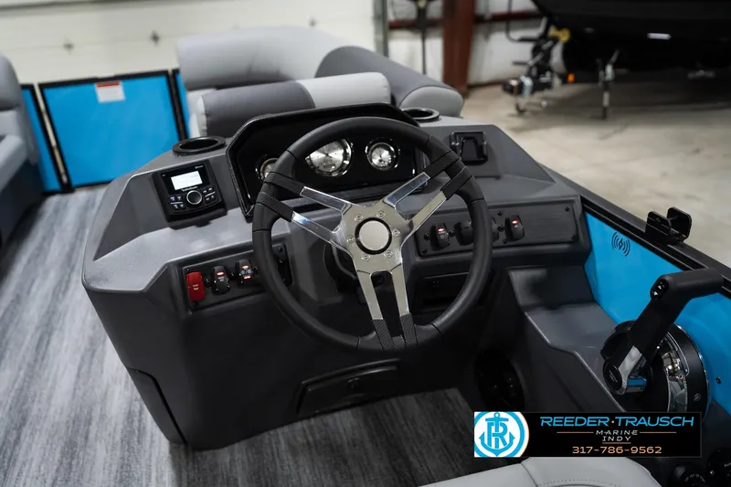 Slide: The Image of Interior view of 2026 Bennington 188 SL boat dashboard with steering wheel and controls. - 31