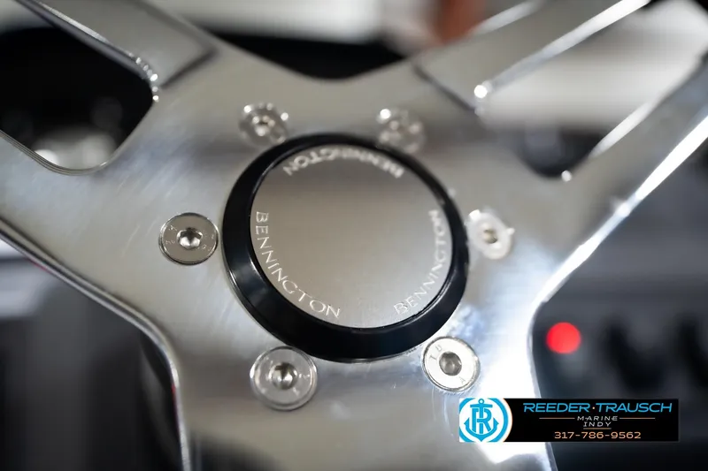 Slide: The Image of Close-up of 2026 Bennington 188 SL steering wheel with logo and branding. - 32