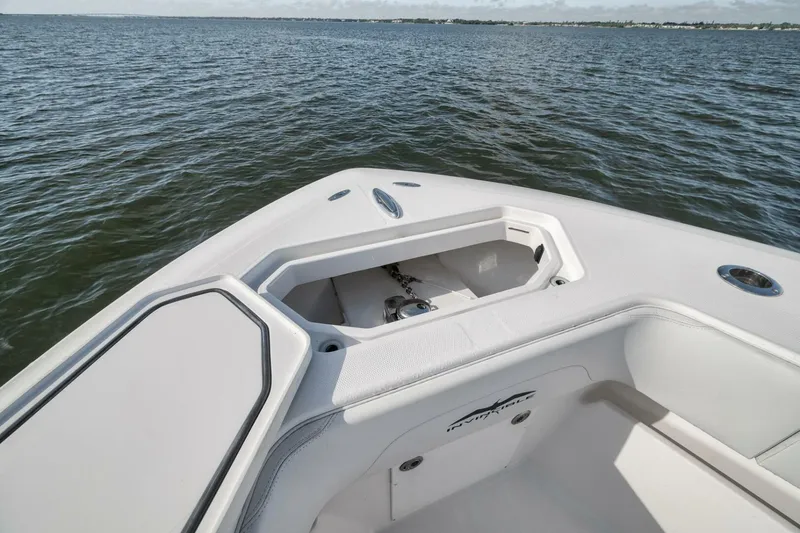 Slide: The Image of 2018 Invincible 36' Open Fisherman boat on calm water, featuring anchor storage. - 16