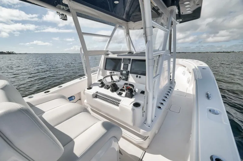 Slide: The Image of 2018 Invincible 36' Open Fisherman boat interior with dual screens and steering wheel. - 21