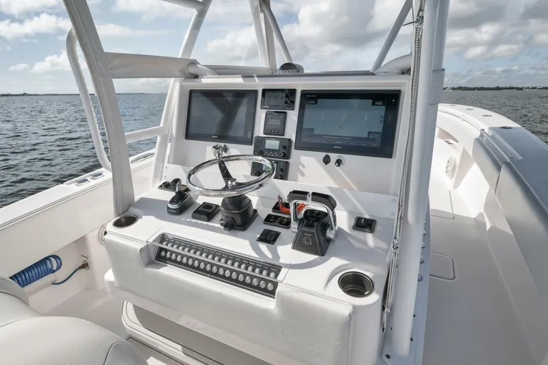 Slide: The Image of Control console of 2018 Invincible 36' Open Fisherman boat with navigation screens. - 22