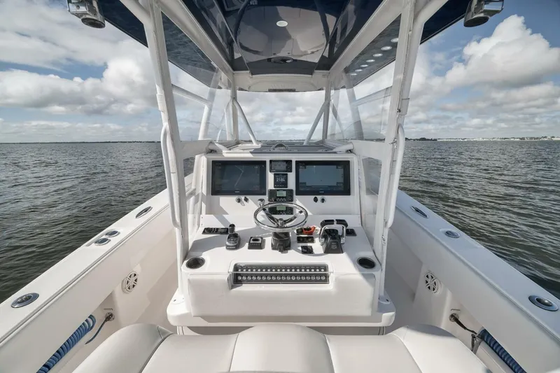 Slide: The Image of 2018 Invincible 36' Open Fisherman boat cockpit with advanced navigation systems. - 23