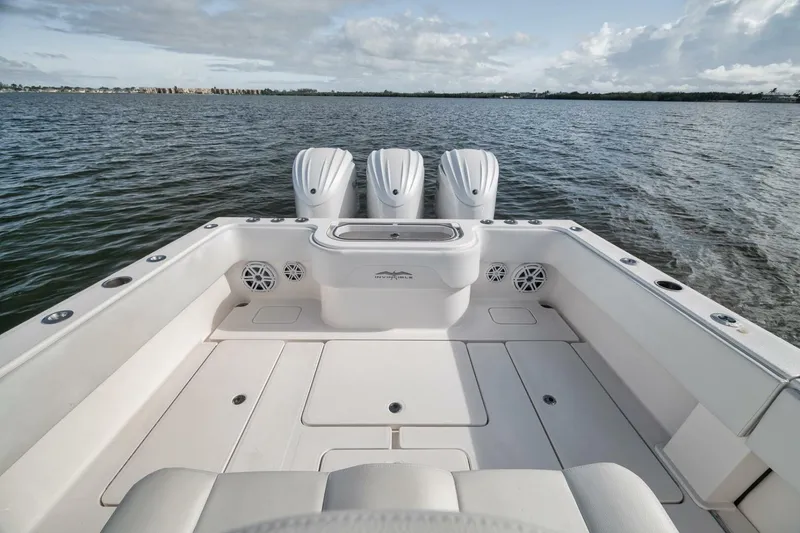 Slide: The Image of 2018 Invincible 36' Open Fisherman boat with triple engines on calm water. - 28