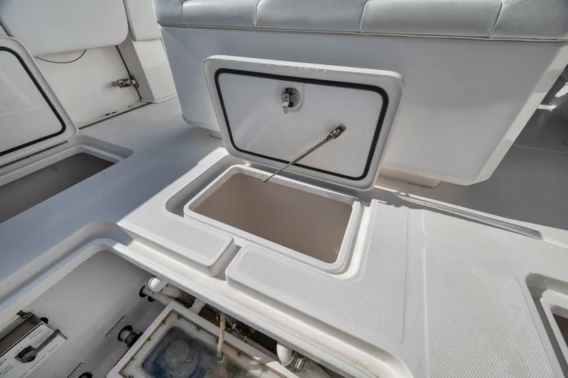 Slide: The Image of 2018 Invincible 36' Open Fisherman boat storage compartments and seating area. - 29