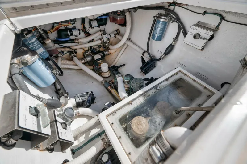 Slide: The Image of Engine compartment of 2018 Invincible 36' Open Fisherman with visible filters and hoses. - 30