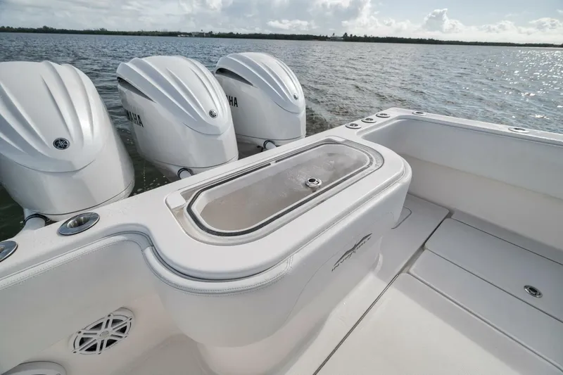 Slide: The Image of 2018 Invincible 36' Open Fisherman boat with triple Yamaha engines on the water. - 31