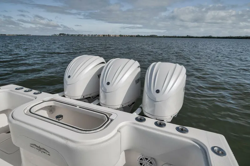 Slide: The Image of 2018 Invincible 36' Open Fisherman with triple Yamaha outboard engines on the water. - 33