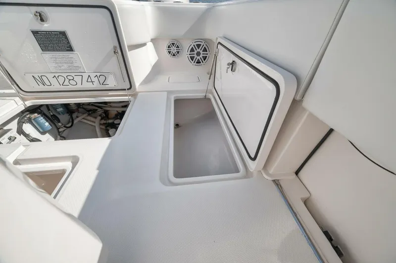 Slide: The Image of 2018 Invincible 36' Open Fisherman boat storage compartments and access hatches. - 35