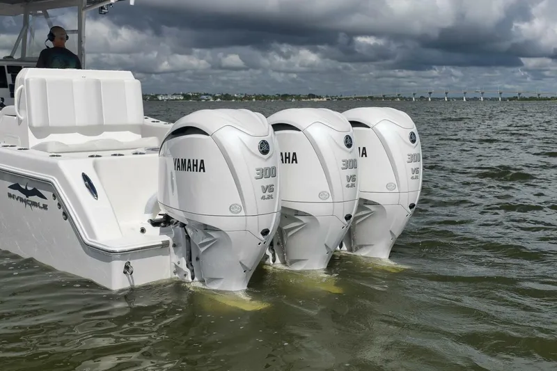 Slide: The Image of 2018 Invincible 36' Open Fisherman with triple Yamaha 300 V6 engines on water. - 38