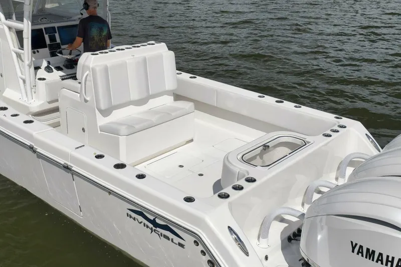 Slide: The Image of 2018 Invincible 36' Open Fisherman boat on water, featuring Yamaha engines. - 4