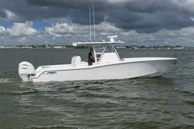 Slide: The Image of 2018 Invincible 36' Open Fisherman boat on water, featuring Yamaha engines. - 6
