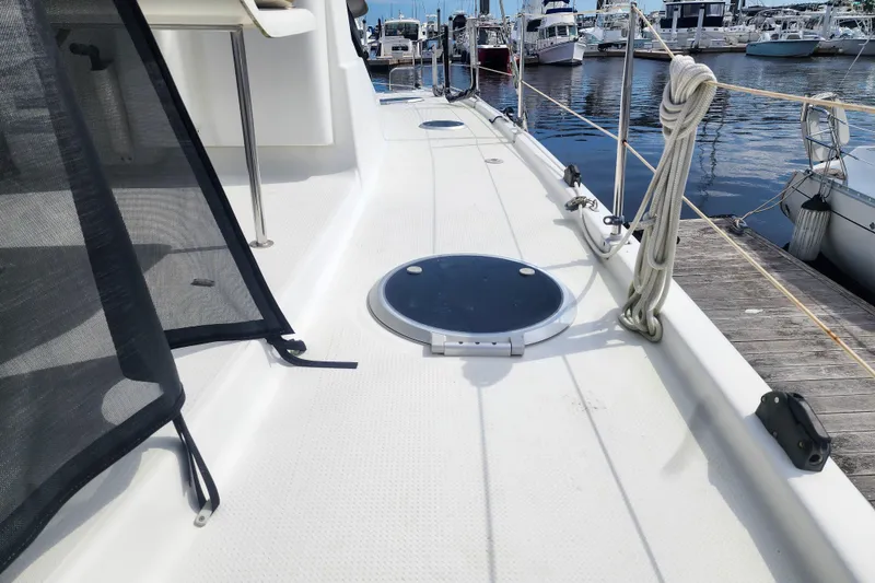 Slide: The Image of 2013 Fountaine Pajot Lipari 41 catamaran deck view at marina. - 10