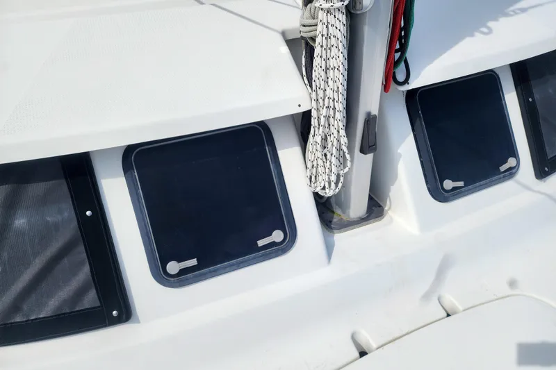 Slide: The Image of 2013 Fountaine Pajot Lipari 41 catamaran deck with windows and ropes. - 15
