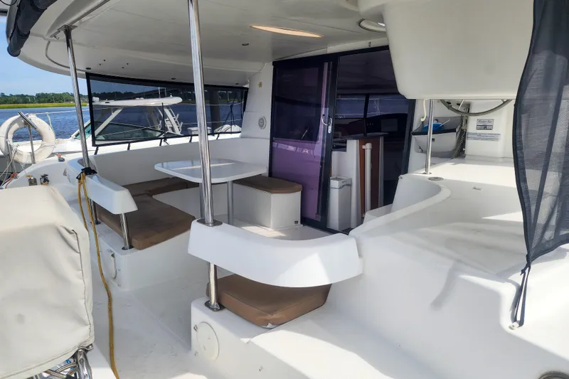 Slide: The Image of 2013 Fountaine Pajot Lipari 41 catamaran with spacious outdoor seating and dining area. - 17