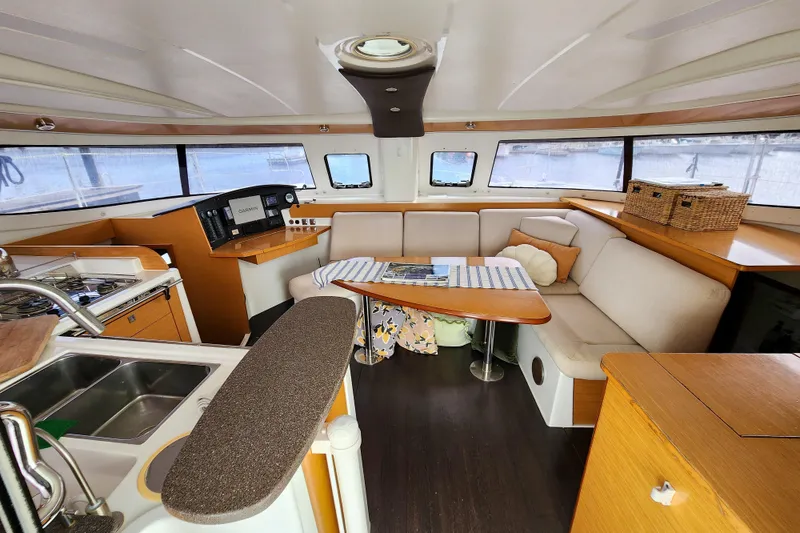 Slide: The Image of Interior of 2013 Fountaine Pajot Lipari 41 catamaran with cozy seating and kitchen area. - 39