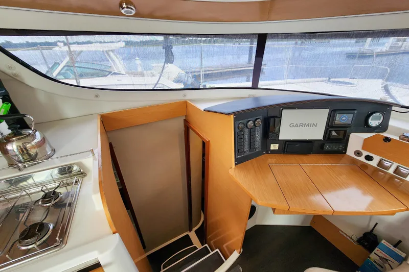 Slide: The Image of Interior of 2013 Fountaine Pajot Lipari 41 catamaran with navigation equipment and kitchenette. - 43