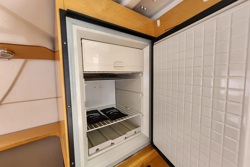 Slide: The Image of Open refrigerator inside 2013 Fountaine Pajot Lipari 41 catamaran, showcasing interior storage space. - 47