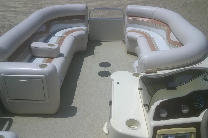 Slide: The Image of 1999 Premier 250 Grand Majestic boat interior with plush seating and control panel. - 15