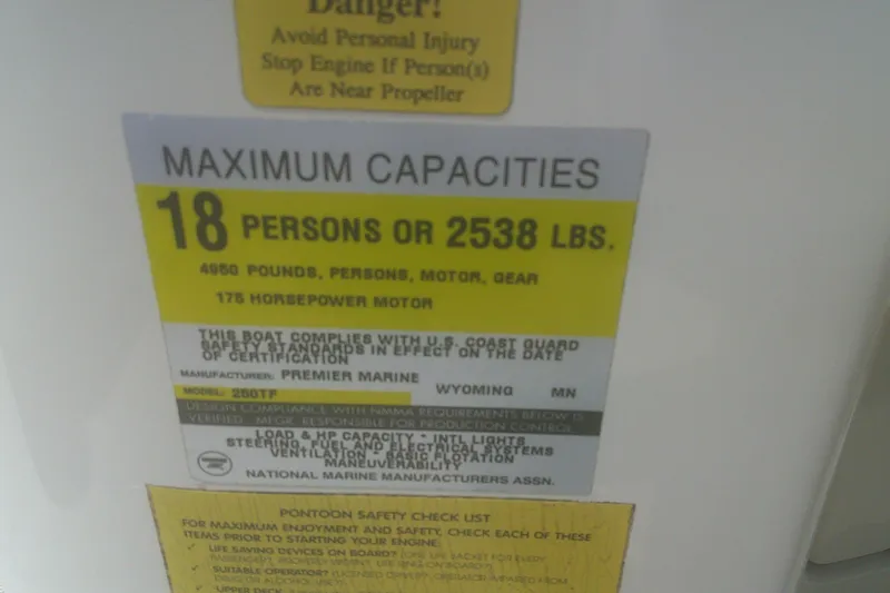 Slide: The Image of 1999 Premier 250 Grand Majestic capacity label: 18 persons or 2538 lbs, 175 HP motor. - 17