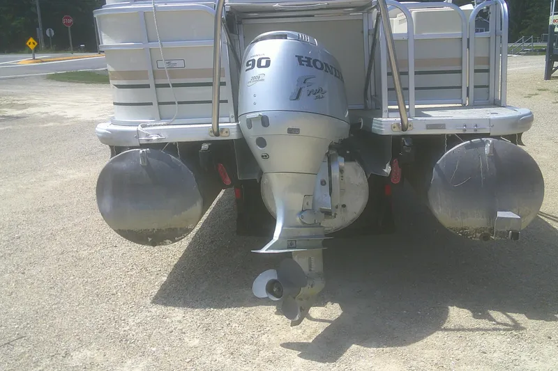 Slide: The Image of 1999 Premier 250 Grand Majestic pontoon boat with Honda 90 outboard motor. - 23