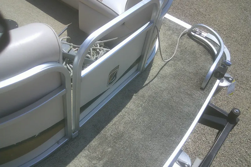 Slide: The Image of 1999 Premier 250 Grand Majestic boat interior with seating and rope details. - 6