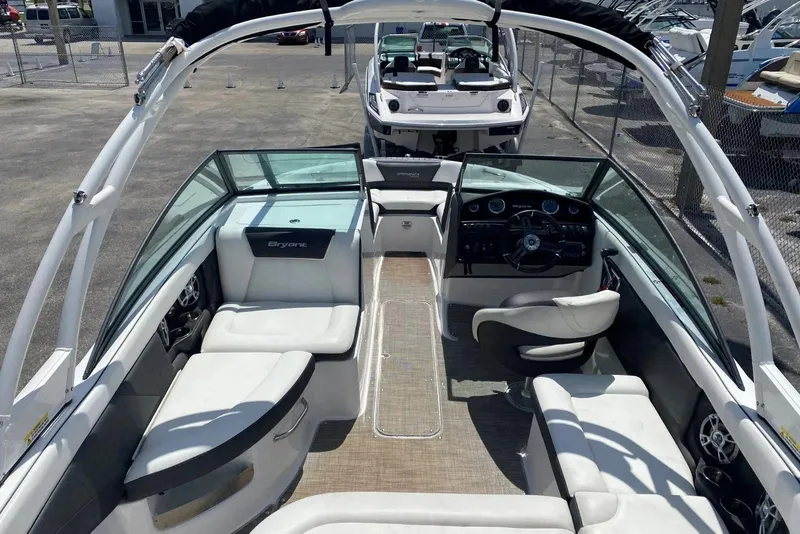 Slide: The Image of 2019 Bryant Speranza boat interior with white seating and modern dashboard. - 5