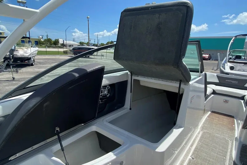 Slide: The Image of 2019 Bryant Speranza boat interior with open storage compartments under sunny sky. - 8